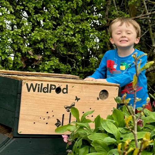 Young boy with a WildPod Mini - budding David Attenborough